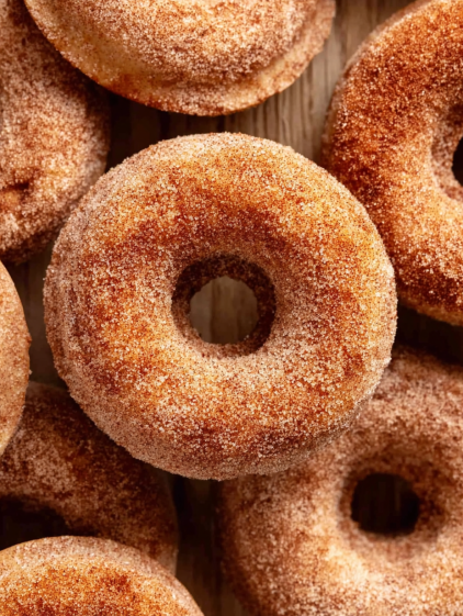 A close up of a sugar donut.