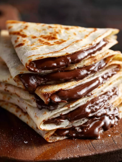 A stack of chocolate-covered crepes.