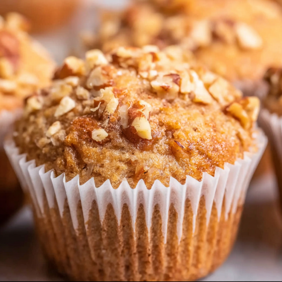 A muffin with nuts on top.