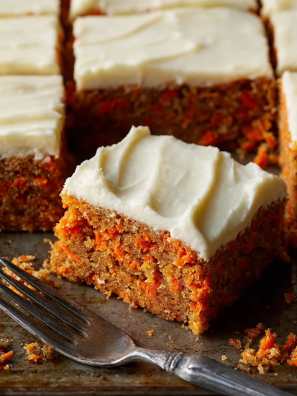 A slice of carrot cake on a plate.
