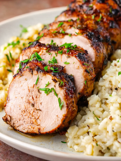 A plate of food with rice and meat.