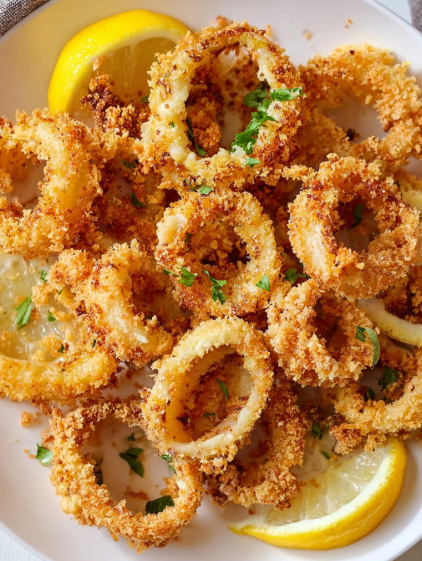 A plate of food with a lemon on top.
