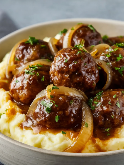 A bowl of slow cooker French onion meatballs.