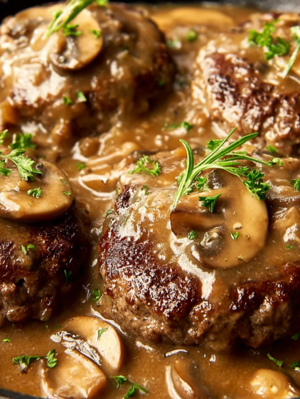 A close up of a delicious meal with mushrooms and meat.