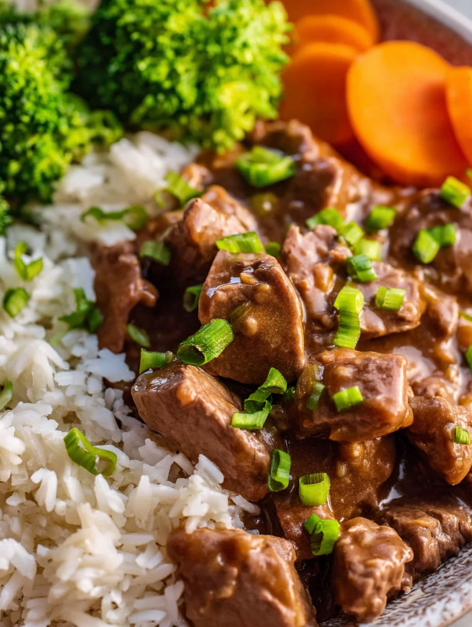 A close up of a delicious meal of beef tips and gravy.