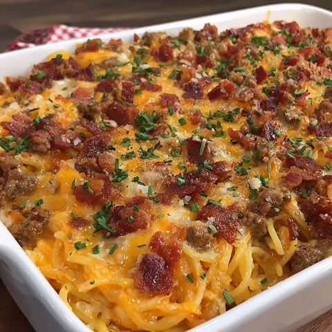 A dish of spaghetti with meat and cheese.