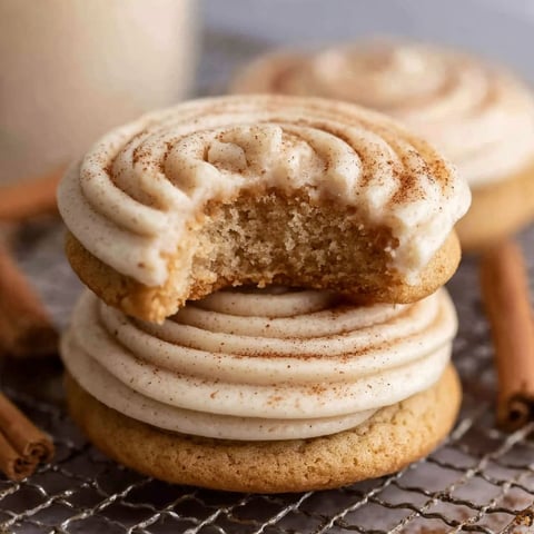 A cookie with a bite taken out of it.