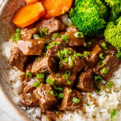 A bowl of beef tips and gravy.