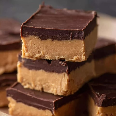 A stack of chocolate and peanut butter bars.