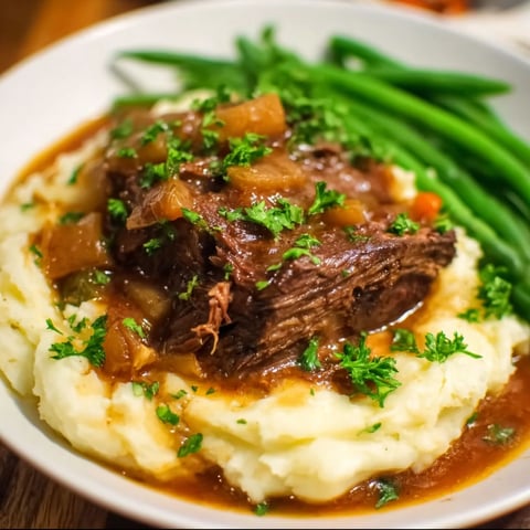 A plate of food with meat and vegetables.